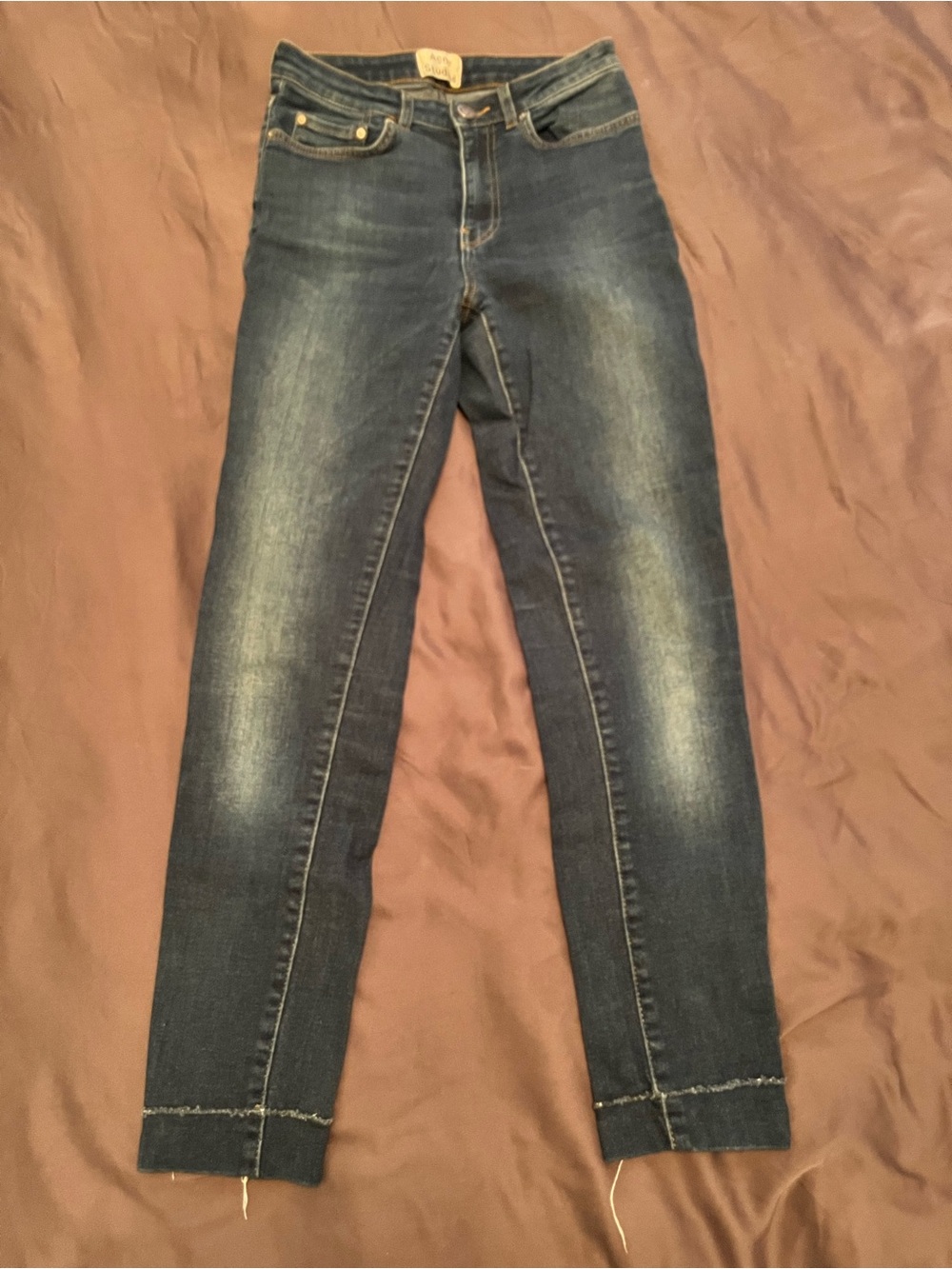 Acne Studios dark indigo jeans with gold hardware